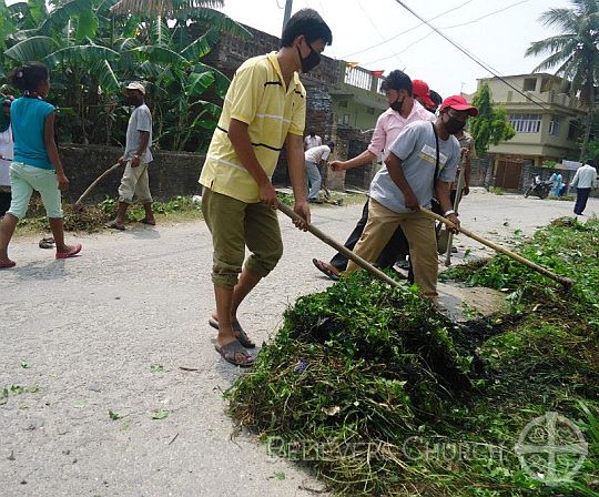 Church Team Cleans Public Road in Birtamod Diocese